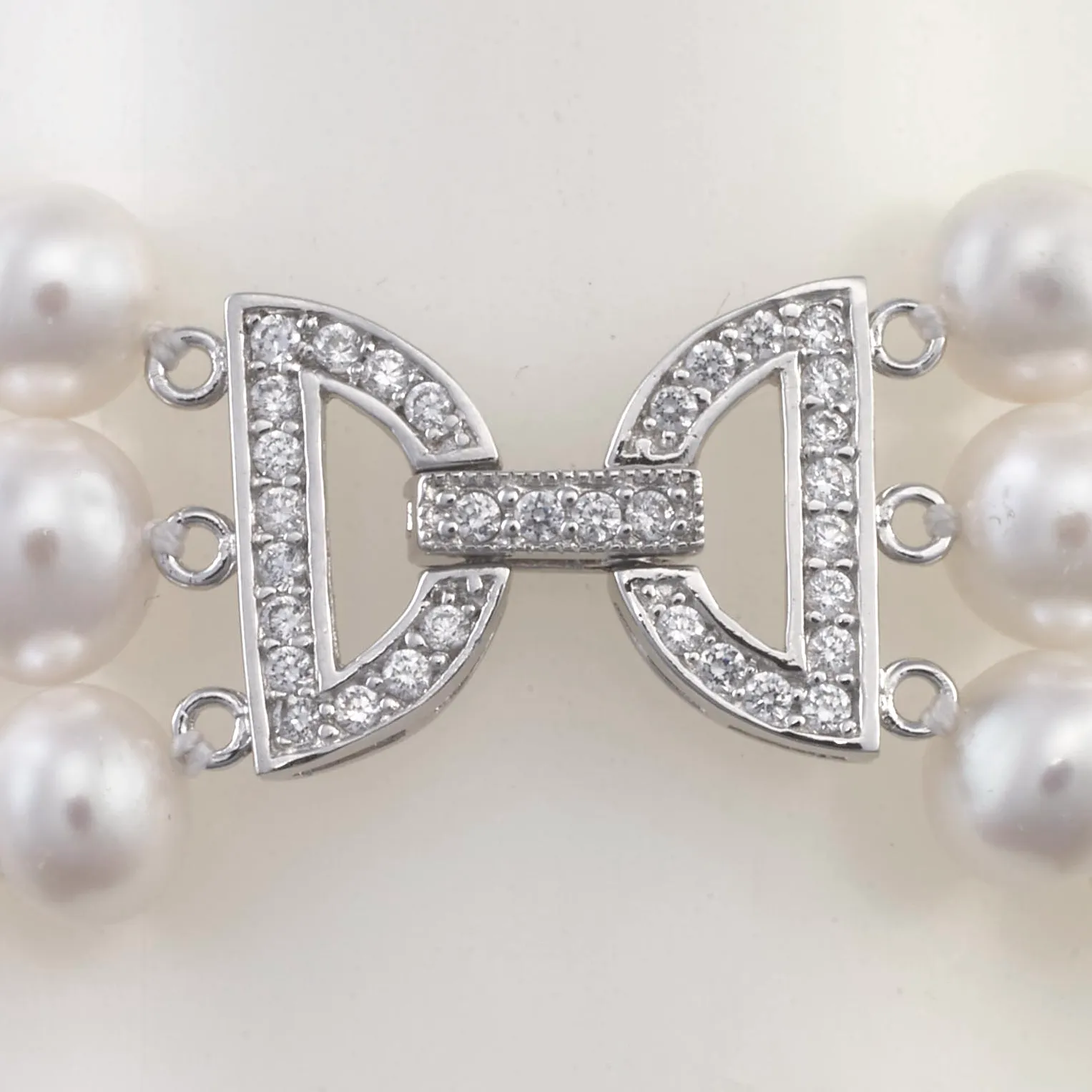 Three-strand pearl and crystal bracelet